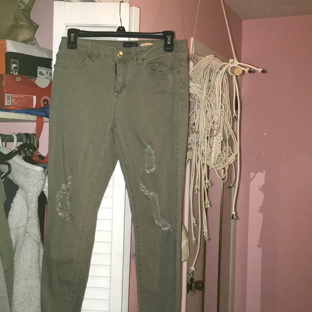 Olive green ripped jeans.